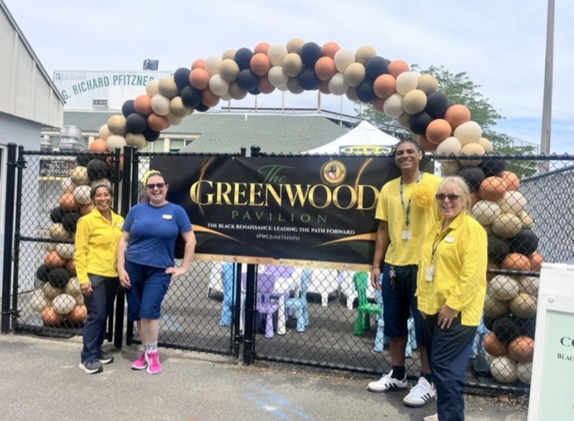 Volunteers welcoming guests at The Greenwood Pavilion community stage entrance